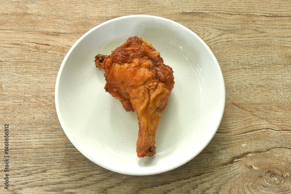 crispy fried chicken tight and leg fermenting with herb on plate