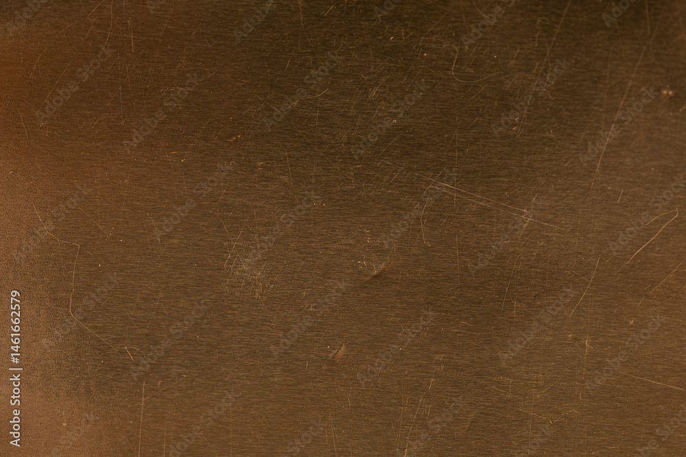 High-resolution photo of a scratched brown metal surface. Perfect for backgrounds and textures.