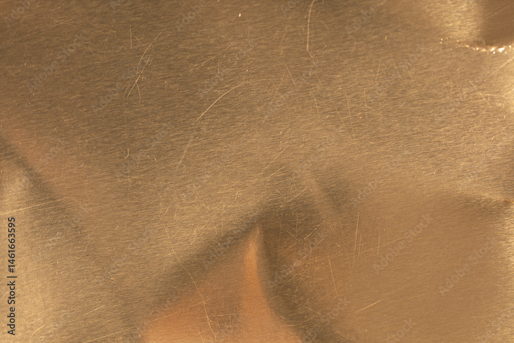 High-resolution image of a scratched gold metal texture. Perfect for backgrounds and design projects.