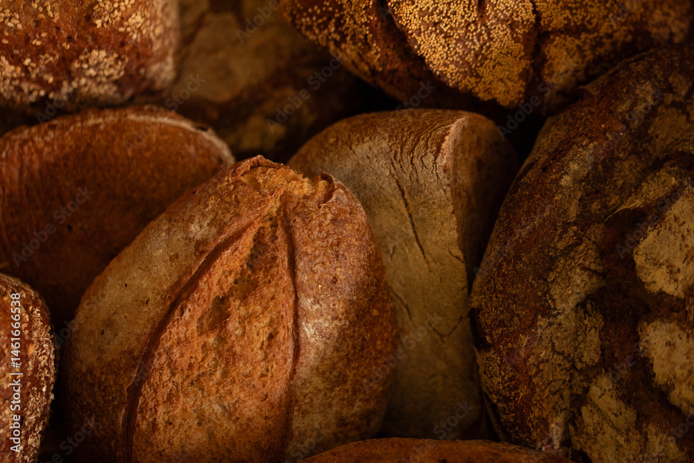 Close-up of freshly baked artisan bread. Golden crust, rustic charm. Perfect for bakery websites.