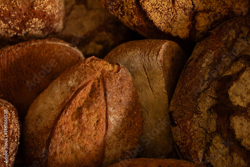 Obraz na płótnie Close-up of freshly baked artisan bread. Golden crust, rustic charm. Perfect for bakery websites. w salonie