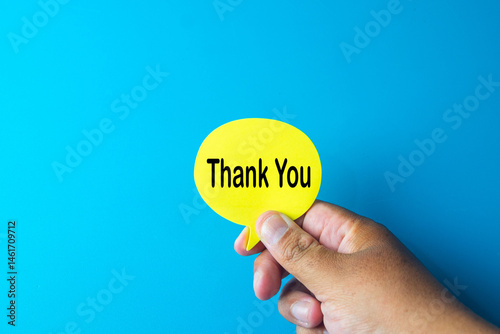 A image showing a hand holding a yellow 