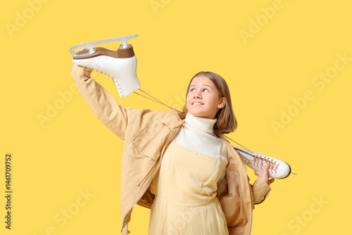 Cute girl with ice skates o...