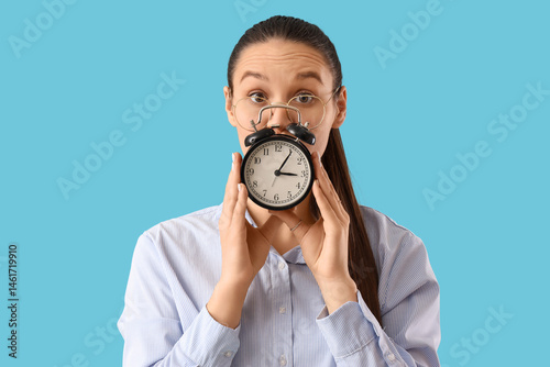 Stressed secretary with ala...