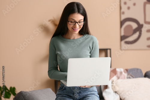 Beautiful young woman worki...