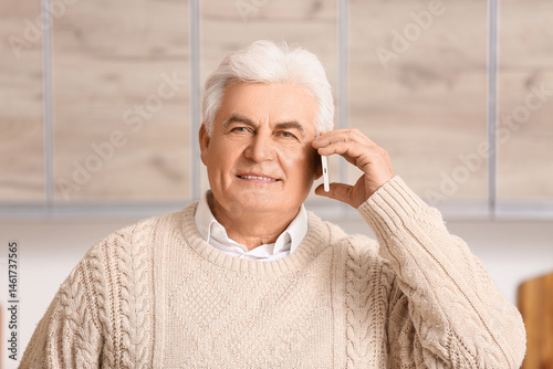 Handsome senior man talking...