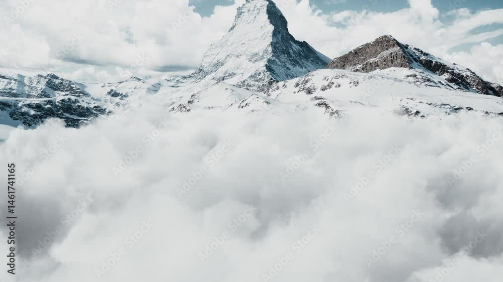 flying above the clouds to the majestic matterhorn