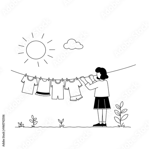 Woman hanging laundry in the sun with clear blue sky