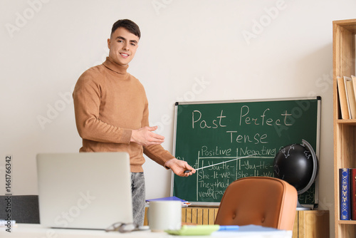 Male teacher conducting Eng...