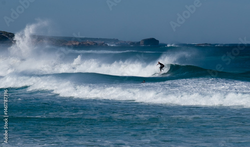 Surfer Captured surfing mid wave on Remote South West Coast photo