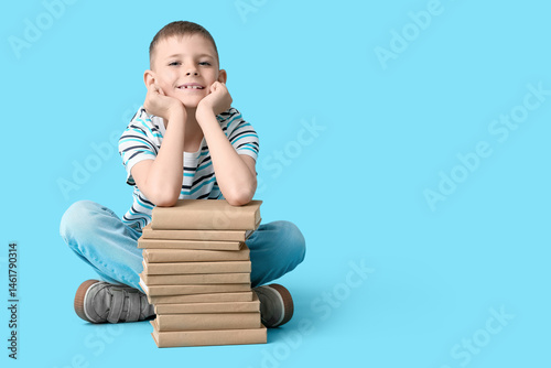 Cute little boy with stack ...