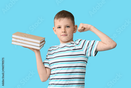 Cute little boy with books ...