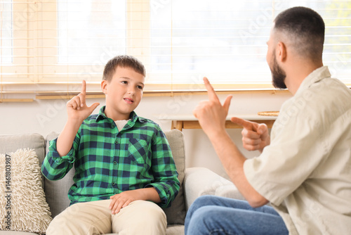 Mute father and son using s...