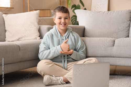 Mute boy using sign languag...