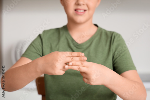 Mute boy using sign languag...