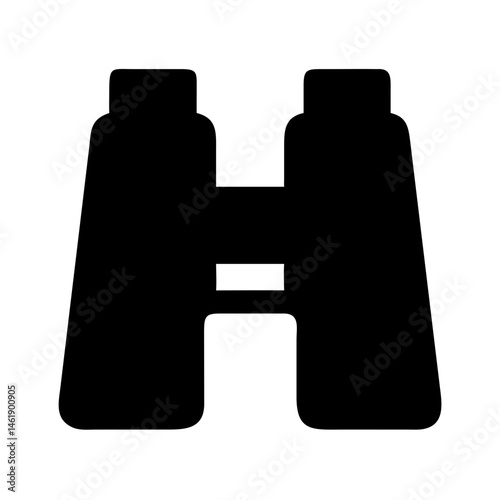Binoculars used for bird watching in a serene natural setting during early morning light