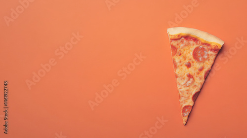 A single slice of pepperoni pizza on a vibrant orange background, showcasing its cheesy goodness.
