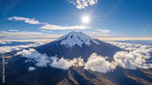 Majestic snow-capped volcano piercing through clouds