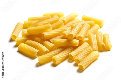 Close-up view of uncooked tortiglioni pasta scattered on a white surface, showing smooth texture and ridged tube shapes ideal for holding sauce photo