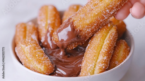 Crispy, sugared pastries dipped in rich chocolate