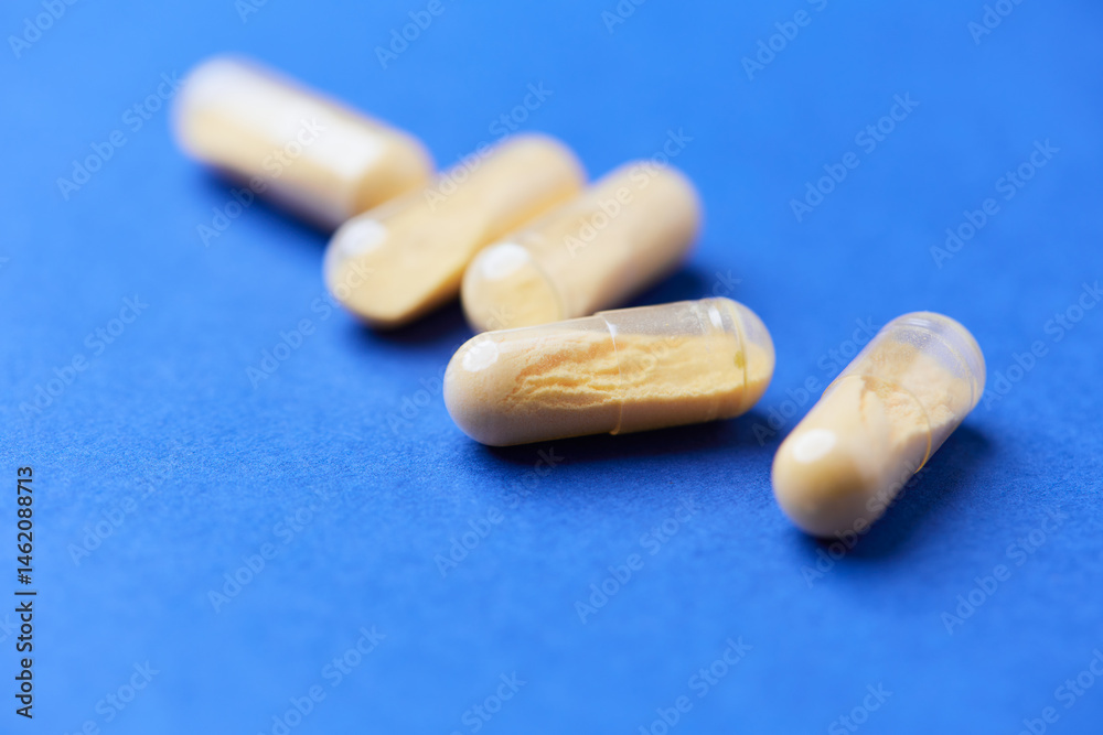 Coenzyme Q10 capsules. Antioxidants. Concept for a healthy dietary supplementation. Bright background. Soft focus. Close up. Copy space. Coenzyme Q10 capsules. Antioxidants. Concept for a healthy dietary supplementation. Bright background. Soft focus. Close up. Copy space.