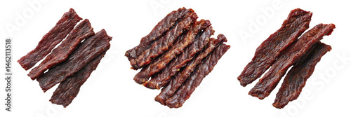 Stacks of delicious realistic beef jerky strips arranged on a white background showcasing texture and color variation