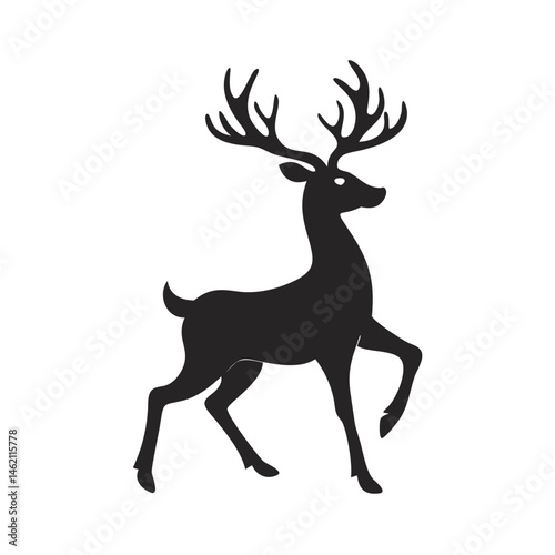 Elegant black silhouette of a deer gracefully walking in a natural setting during daylight hours