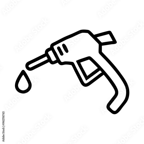 Fuel pump nozzle dispensing gasoline at a fueling station during daytime hours