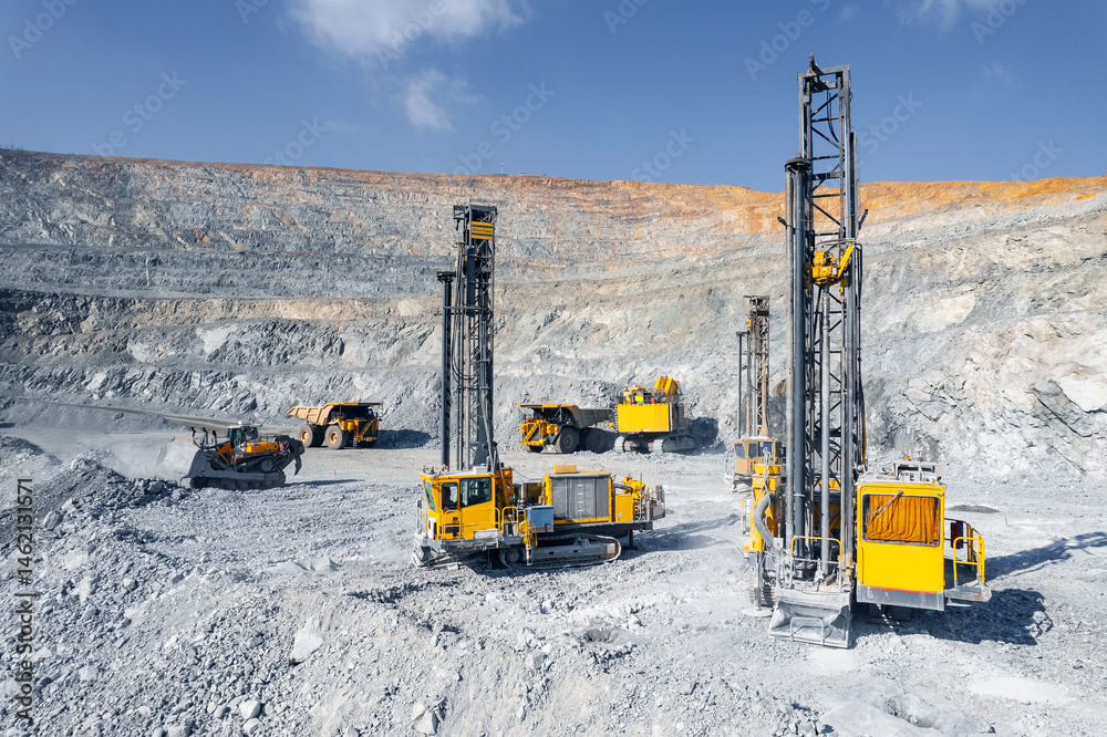 Fototapeta premium Open pit mine, extractive industry for gold ore, top view aerial drone.