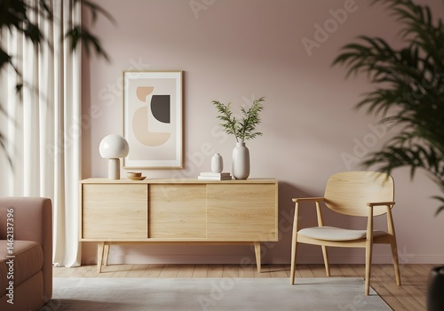 Light oak sideboard and chair in a minimalist living room with blush walls and a modern art print.