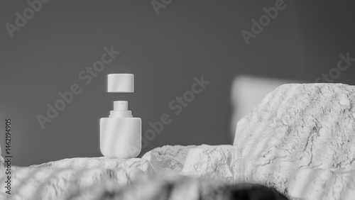 Bottle of perfume is shown on a rocky surface. The bottle is black and has a black cap. The bottle is placed on a rock, and the rock is surrounded by other mossy rocks. Premium photo 3d render.