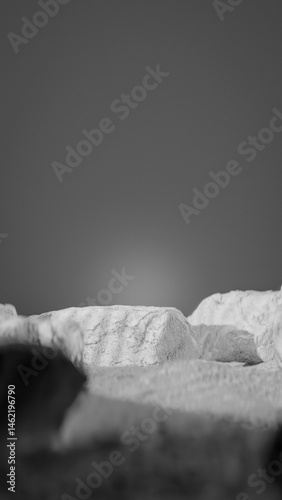 Bottle of perfume is shown on a rocky surface. The bottle is black and has a black cap. The bottle is placed on a rock, and the rock is surrounded by other mossy rocks. Premium photo 3d render.