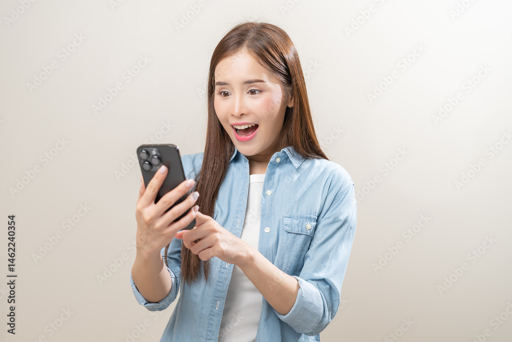 Naklejka premium Happy with phone asian young woman, girl holding mobile smart phone, read good news winning feel excited getting offer, great positive surprise, celebrate success on smartphone isolated on background.