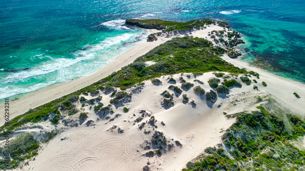 Obraz premium Aerial view of Sandy Cape Reserve near Jurien Bay, Western Australia, featuring pristine beaches and dunes