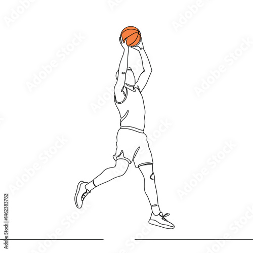 Basketball player jumping to shoot ball in dynamic motion  