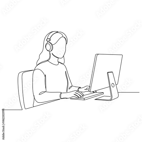 Woman using computer for video interview while wearing headphones 