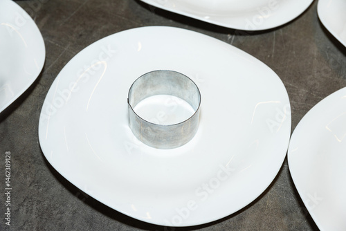 Empty plating ring mold on white plate.