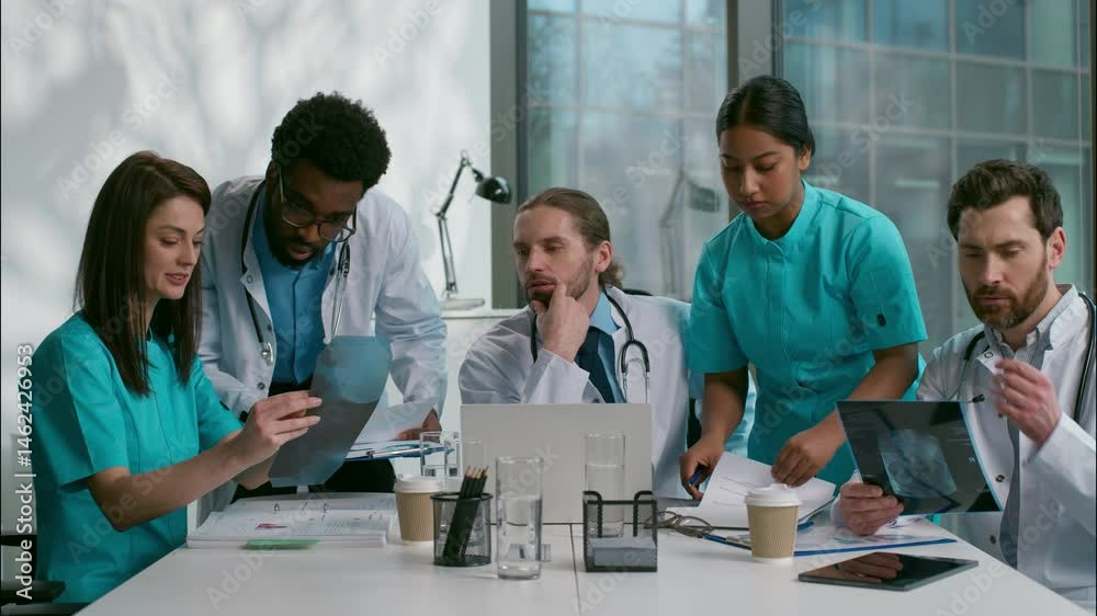 Group multiethnic doctors thinking discussion meeting diverse women men doc specialists medical students surgery planning brainstorm talking speaking disease analyzing health x-ray at hospital clinic