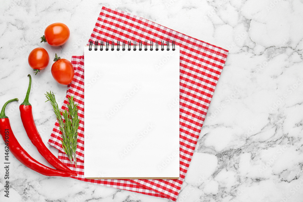 Fototapeta premium Blank recipe book and products on white marble table, top view. Mockup for design