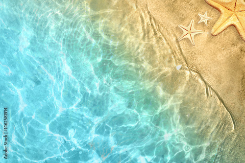 Fototapeta Naklejka Na Ścianę i Meble -  Starfish on the summer beach. Summer background. Tropical sand beach