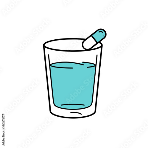 Glass of blue liquid with a capsule  