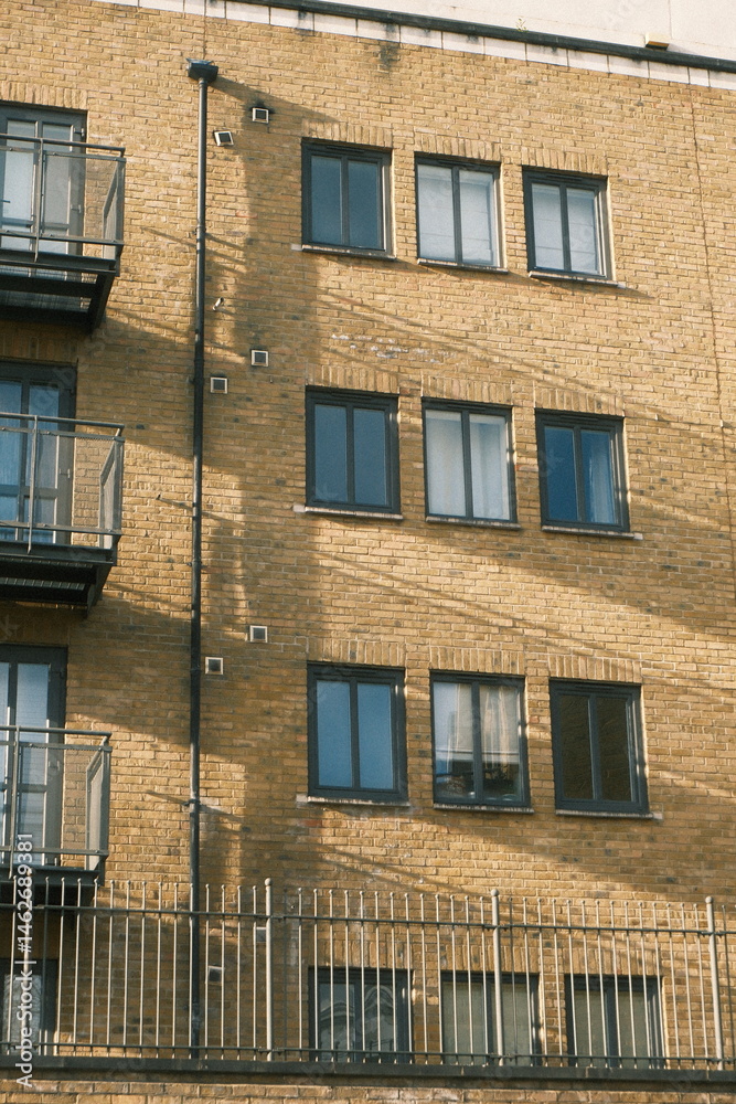 Fototapeta premium A highly detailed photo of the building is made of brick with artistic lighting. weather: . mood: moody and dramatic.