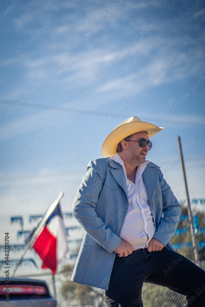 Obraz premium Car Salesman Dancing With Hands on Waist At Texas Car Dealership With Texas Flag in the Background