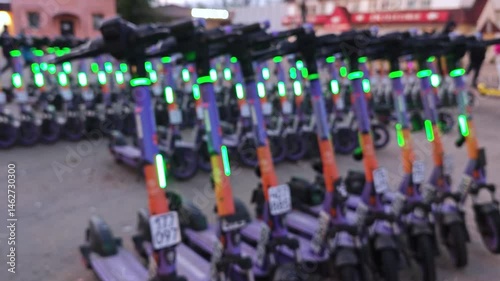 Electric scooter parked. Blurred background.