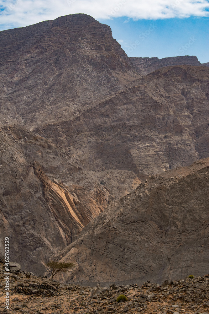 Oman, 03-06-2025: canyon and view of the winding road to Jebel Al Harim (Jabal Al Harim), the highest mountain (2,087 metres), located in the Hajar Mountains range, of the Musandam Peninsula
