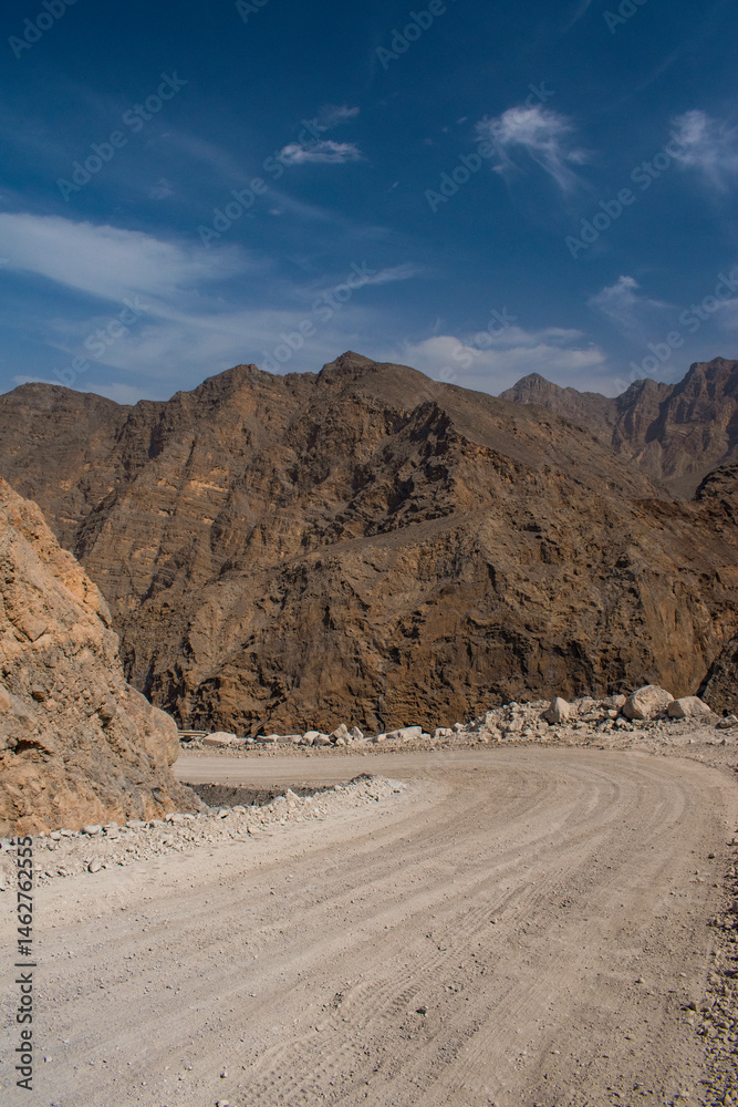 Oman, 03-06-2025: canyon and view of the winding road to Jebel Al Harim (Jabal Al Harim), the highest mountain (2,087 metres), located in the Hajar Mountains range, of the Musandam Peninsula
