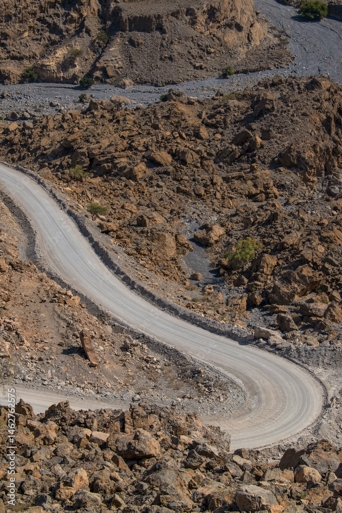 Oman, 03-06-2025: canyon and view of the winding road to Jebel Al Harim (Jabal Al Harim), the highest mountain (2,087 metres), located in the Hajar Mountains range, of the Musandam Peninsula