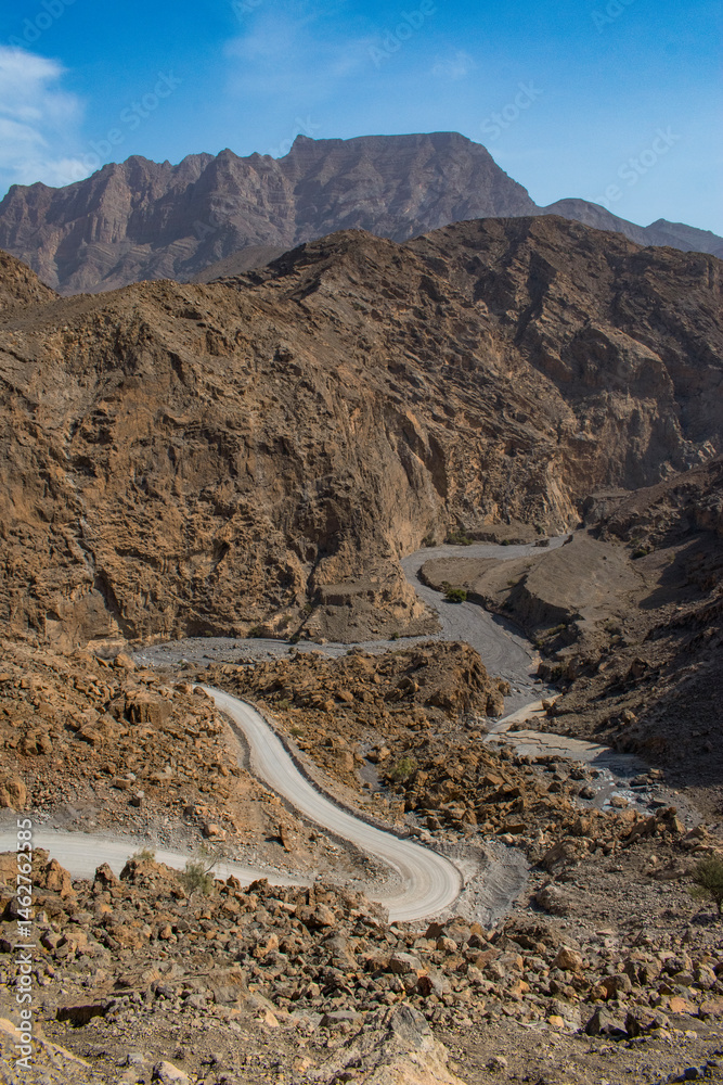 Oman, 03-06-2025: canyon and view of the winding road to Jebel Al Harim (Jabal Al Harim), the highest mountain (2,087 metres), located in the Hajar Mountains range, of the Musandam Peninsula