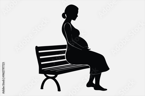 Vector silhouette of a pregnant woman standing in profile