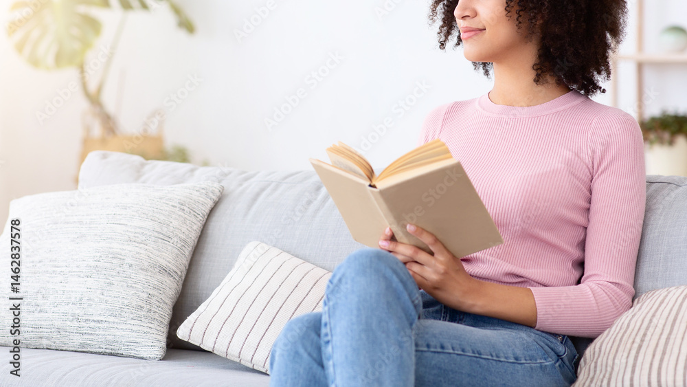 Serene pretty young african american woman feel relaxed, lady dream enjoy wellbeing breathing fresh air in cozy interior in modern living room, reading book and looking out the window, free space Serene pretty young african american woman feel relaxed, lady dream enjoy wellbeing breathing fresh air in cozy interior in modern living room, reading book and looking out the window, free space